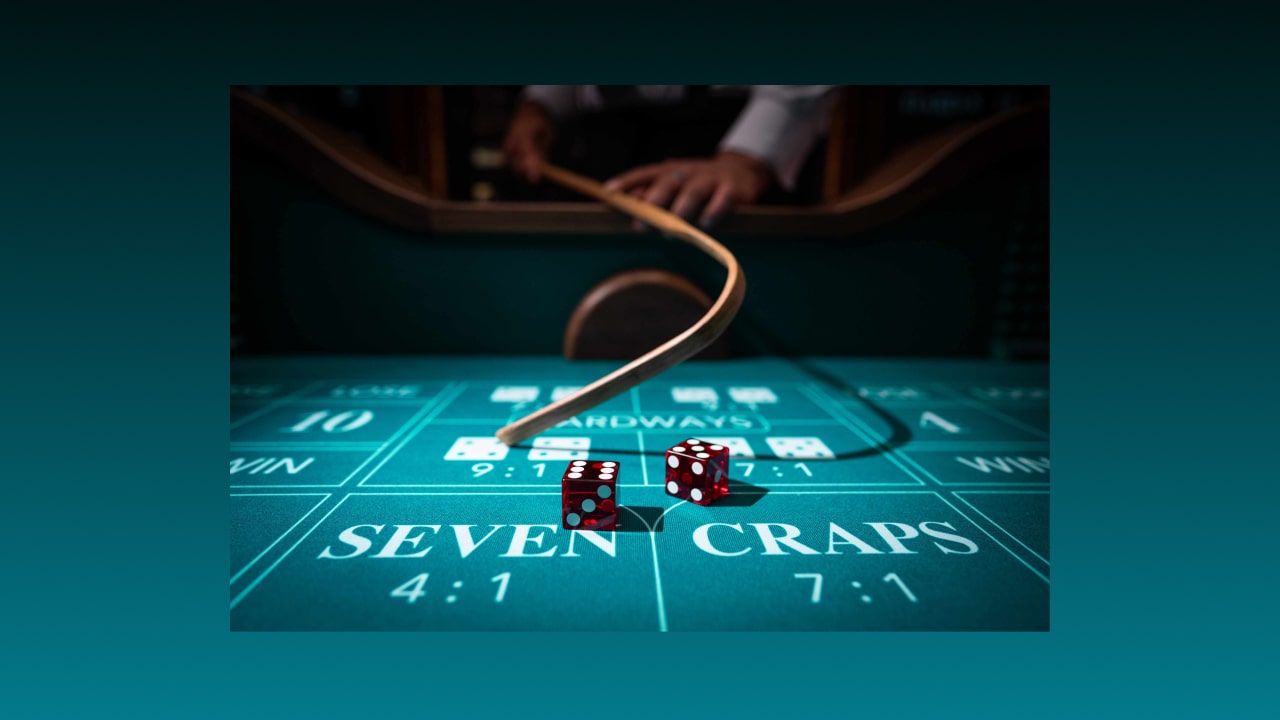 Live casino craps dealer rolling dice with craps stick